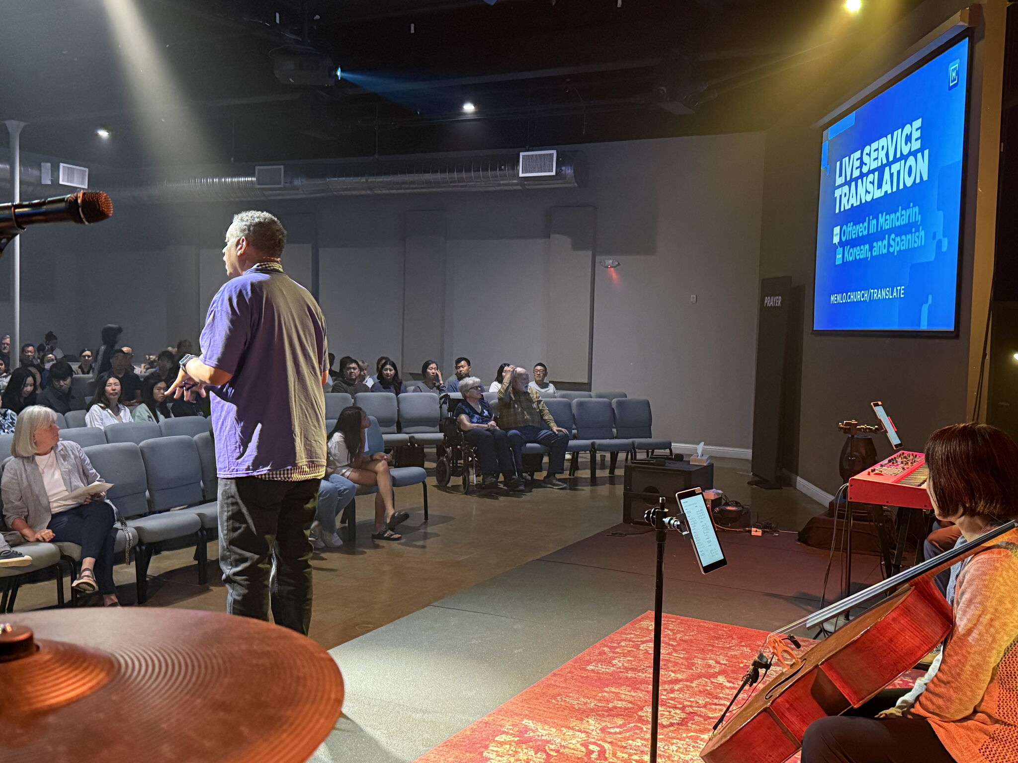 A congregant following real-time translation on a phone at Menlo Church